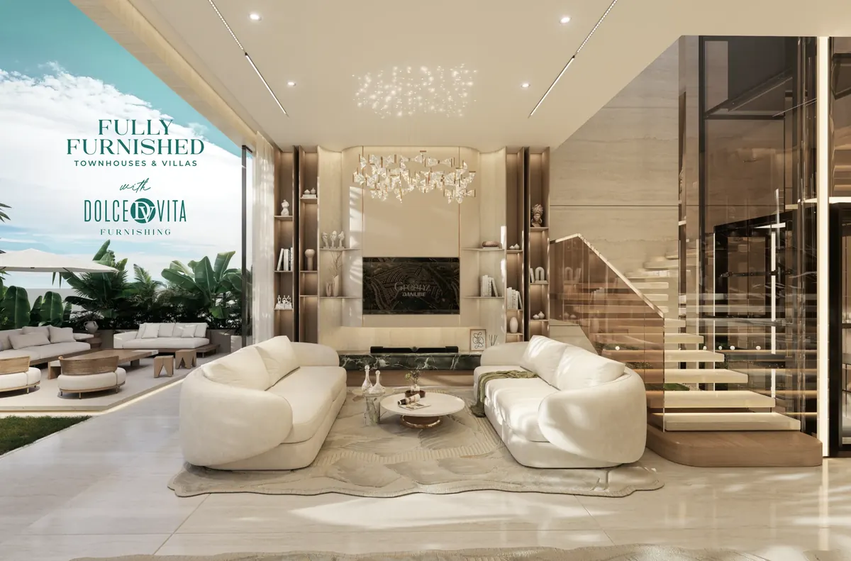 Furnished double-height living room with a floating staircase